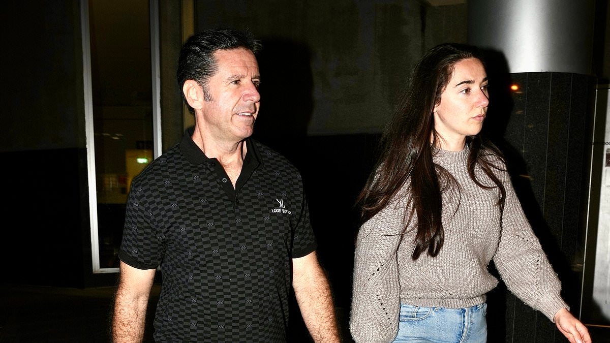 Army major accused of drowning his wife and claiming $1million life insurance SMILES as he walks free from custody and is reunited with his daughters