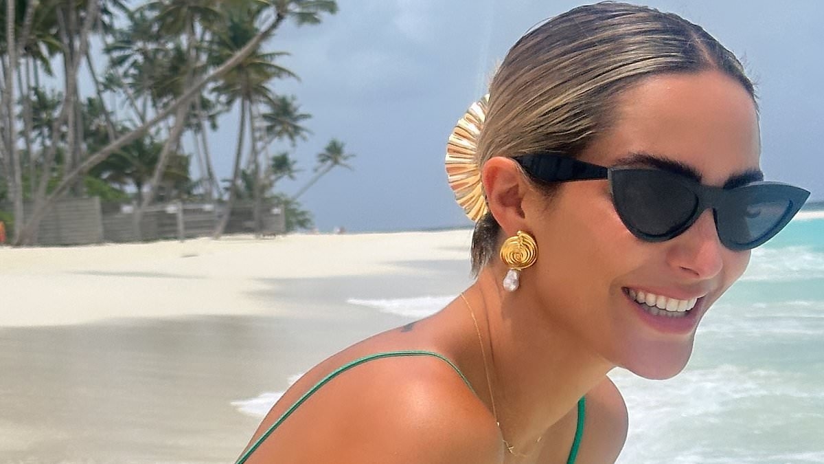 Frankie Bridge shows off her peachy bottom in a tiny green bikini as she larks around in the Maldives amid 'feud' with Myleene Klass