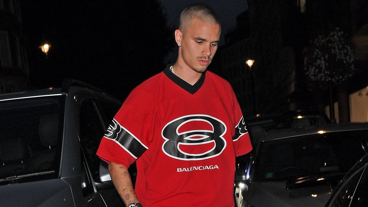 Romeo Beckham flexes his luxury lifestyle in a £1K Balenciaga jersey and Rolex watch as he steps into his pricey £100K Porsche with a pal on night out