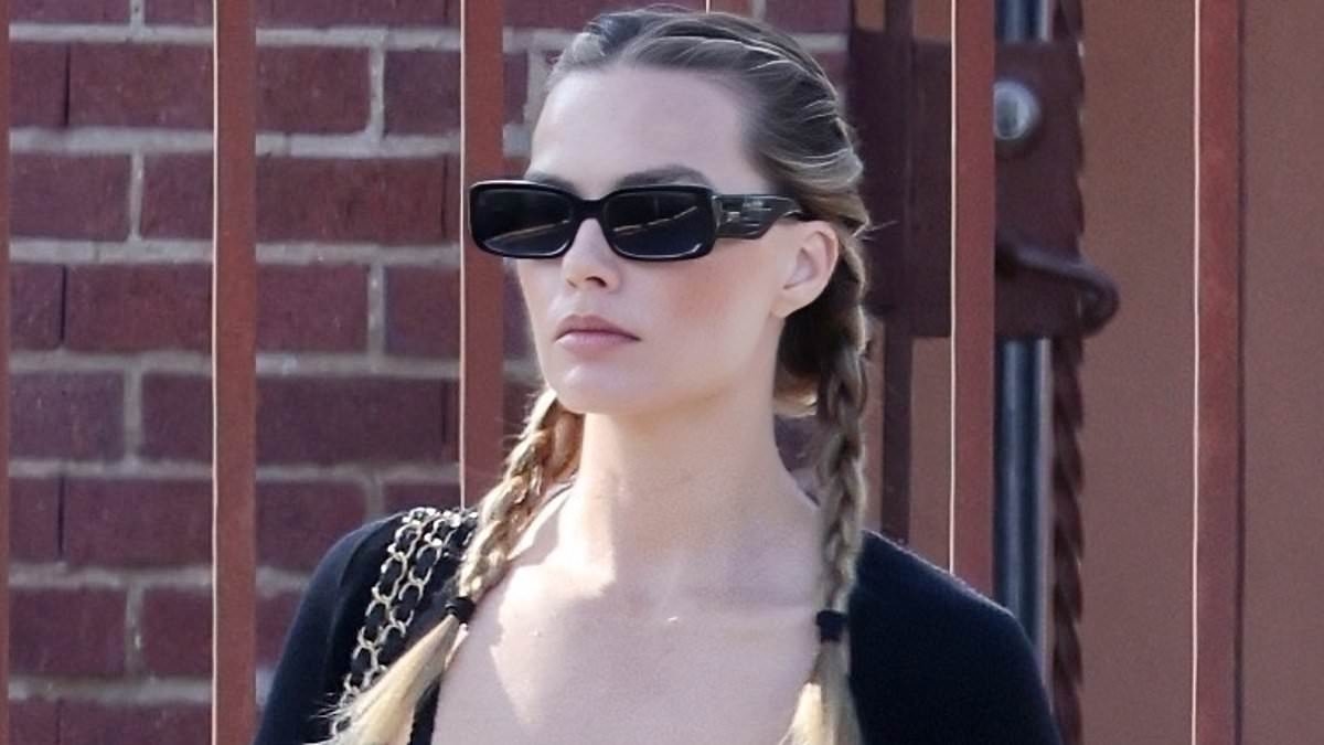 Margot Robbie looks like Britney Spears from her Oops... I Did It Again video with cute schoolgirl braids