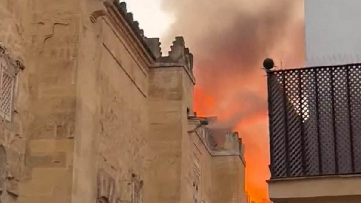 Huge blaze rips through ancient Spanish church: Firefighters battle to save major tourist attraction