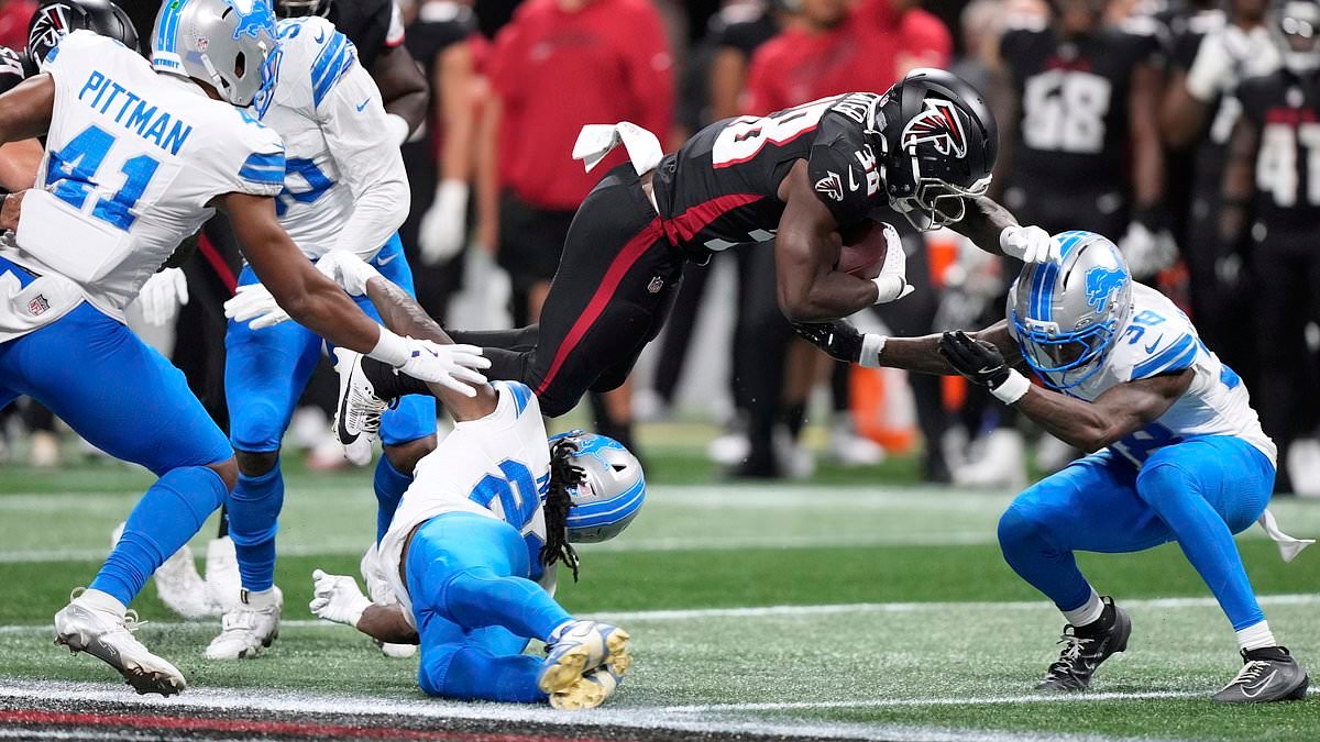 Detroit Lions' Morice Norris is left motionless after frightening hit and stretchered off the field in Atlanta
