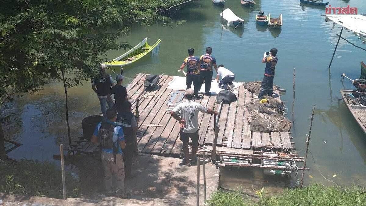 Body of woman found chained 'by the neck' and tied underwater by two dumbbells