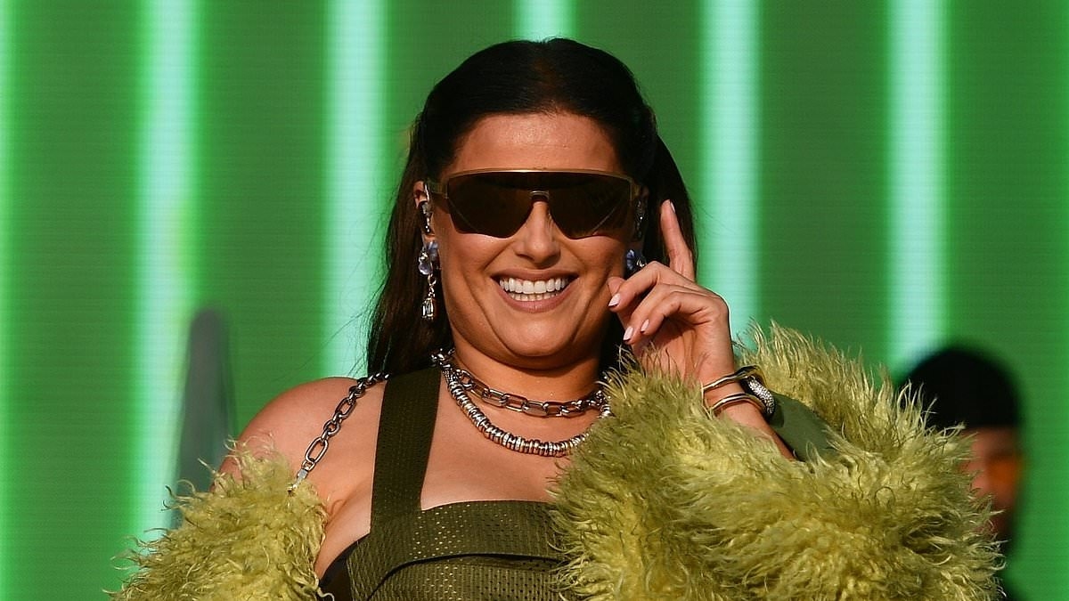 Nelly Furtado, 47, puts on a VERY leggy display in ruffled hotpants at Boardmasters Festival in Cornwall