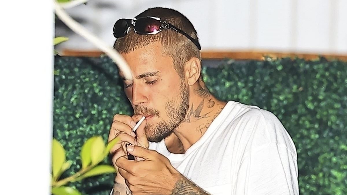 Justin Bieber's date night turns scandalous as he smokes after Hailey dinner then grabs crotch in racy pics