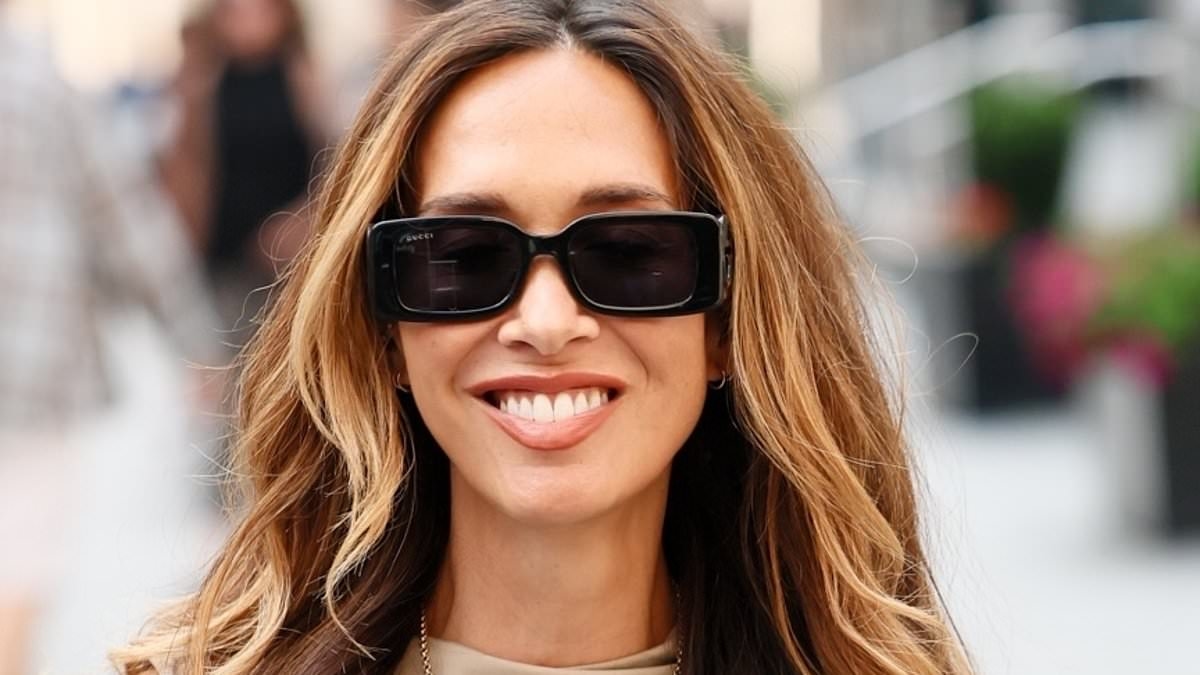 Beaming Myleene Klass defiantly steps out after being branded a 'vindictive bully' by ex Graham Quinn's pals after her shock claims he 'cheated with a celebrity'