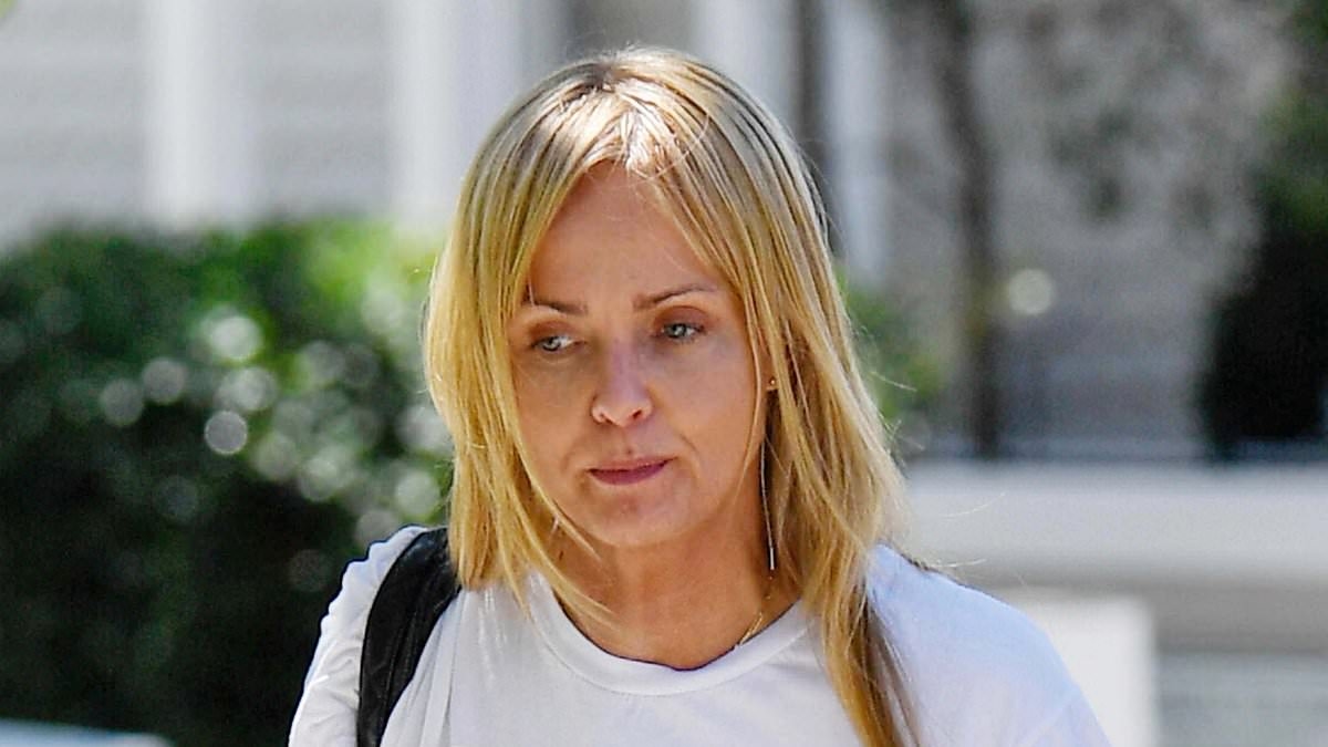 Blonde bombshell best known for playing a Bond Girl is seen on a rare outing... can you guess who?