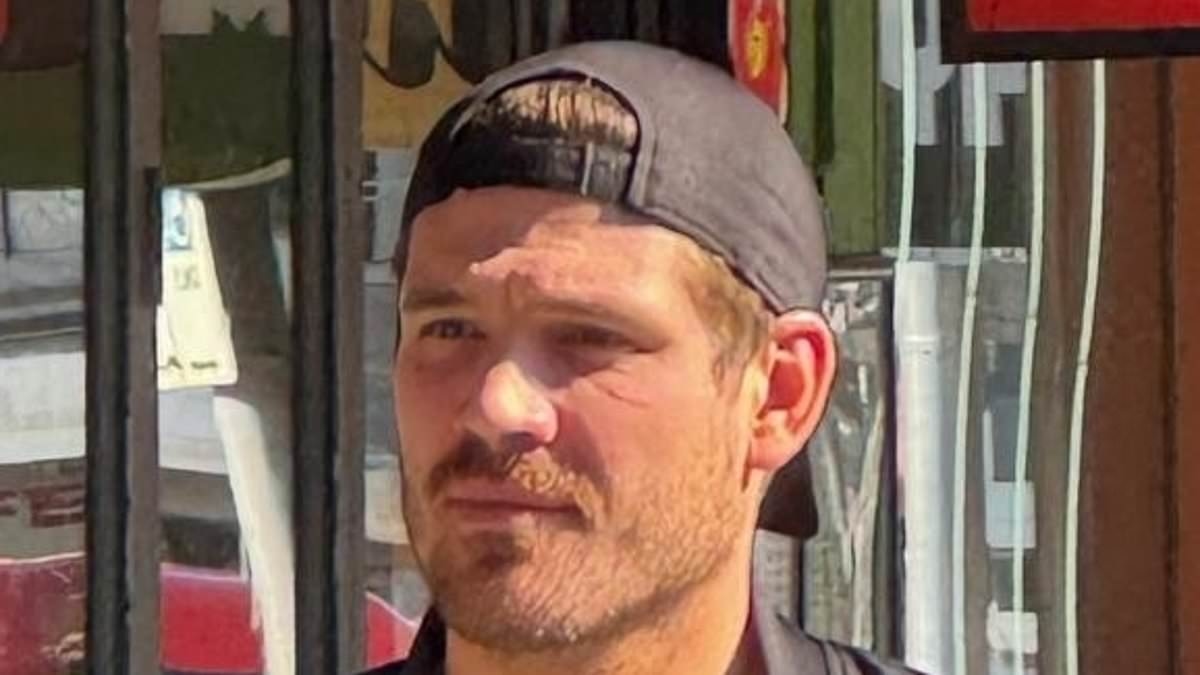 Bad news, Matt? Tammy Hembrow's ex-husband looks downcast as he reads the paper during solo coffee outing after influencer hooks up with AFL heartthrob Bailey Smith