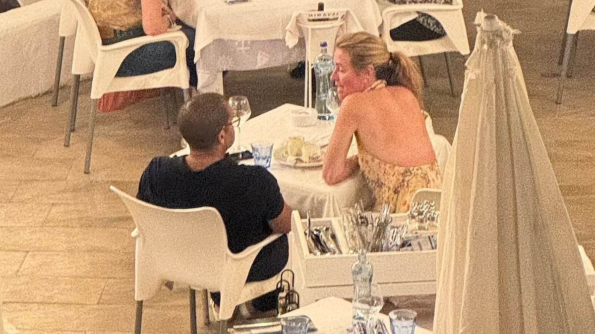 Cat Deeley is snapped for the first time since her shock split from husband Patrick Kielty... with a male friend in Spain