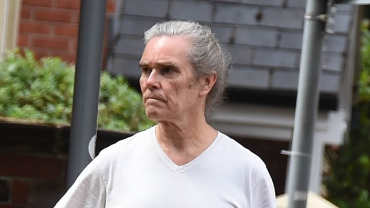 90s rocker looks unrecognisable with a full head of grey hair - can you guess who it is?