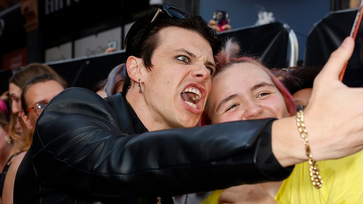 Yungblud is every inch the rock and roll icon as he puts on a VERY animated display at his Are You Ready, Boy? film premiere in London