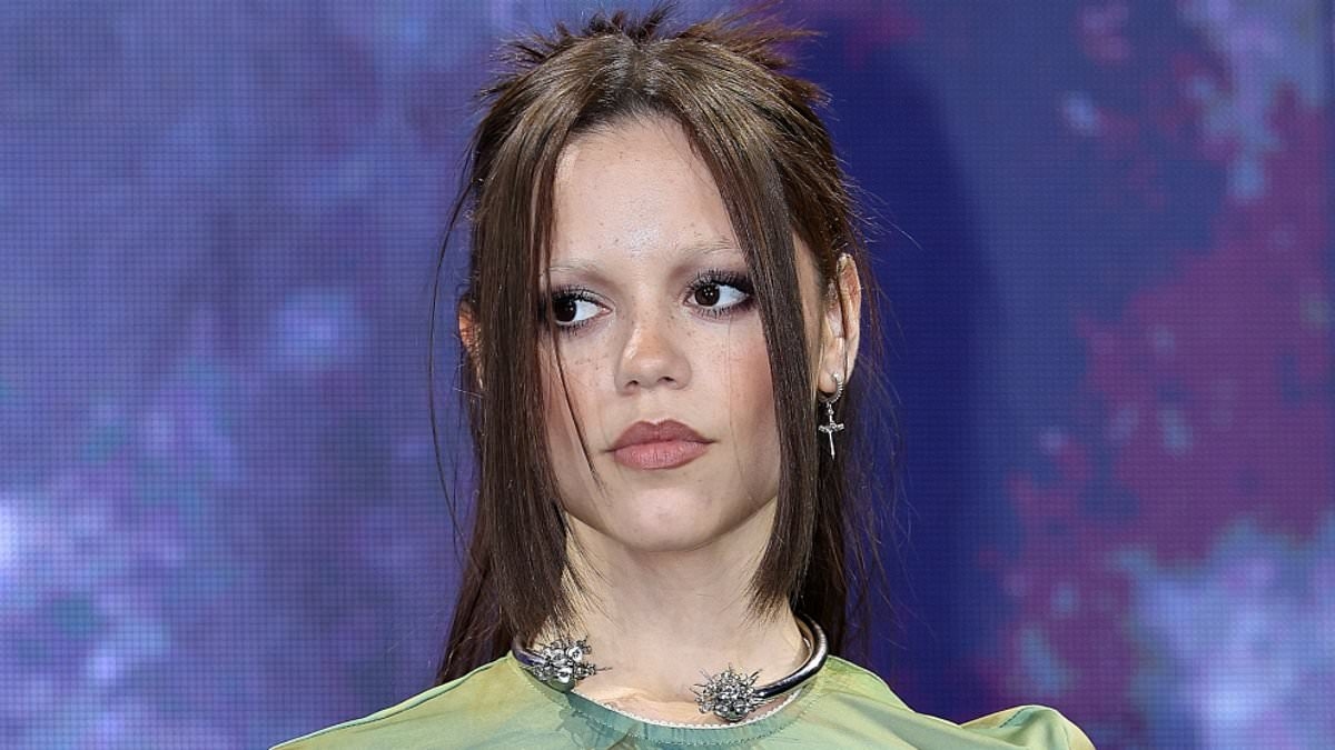 Wednesday by name, Wednesday by nature! Jenna Ortega looks downcast in a Gothic-style outfit as she arrives in Sydney alongside Hollywood legend to promote Netflix series