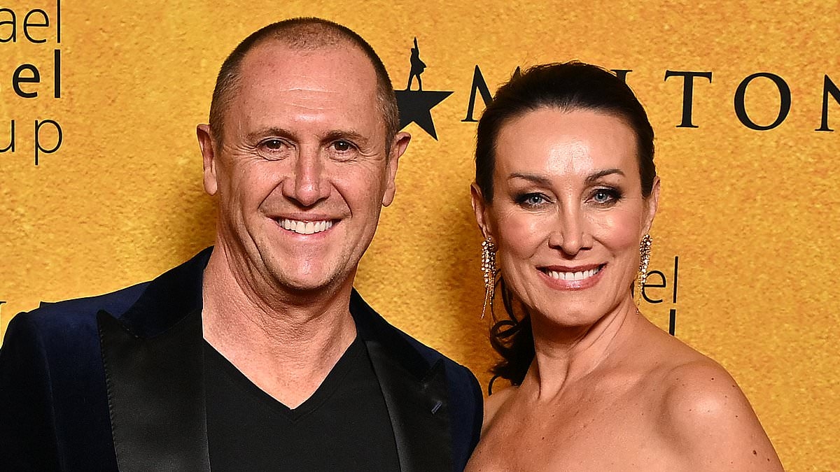 Get a room! Fans are sent into a frenzy as Larry Emdur and his wife Sylvie turn up the heat in a resort pool
