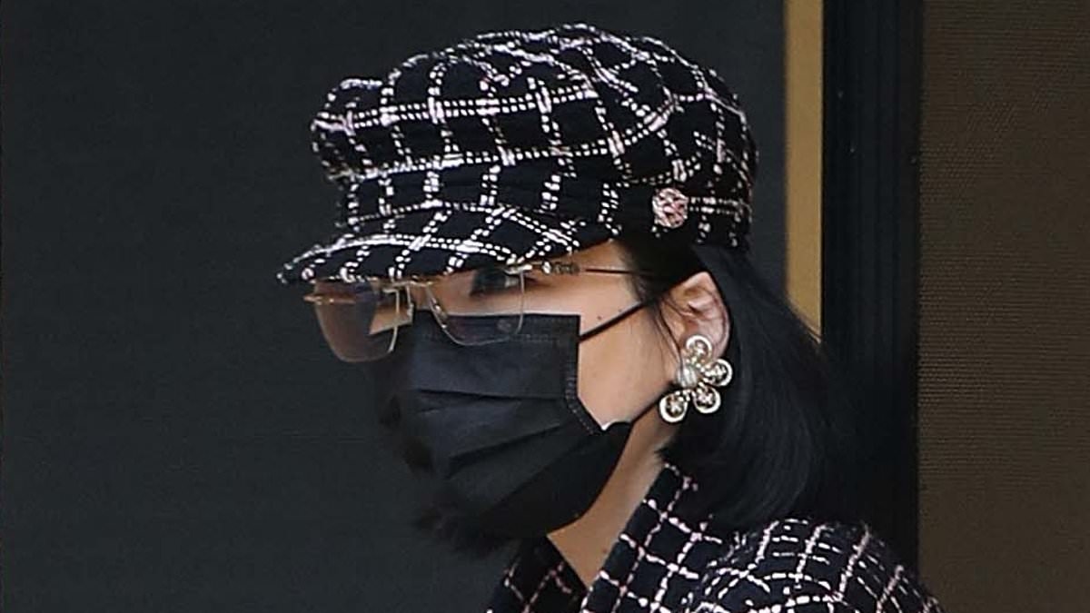 Mysterious wealthy heiress breaks cover in a SUPER expensive Chanel outfit to grab some cash - as she swaps her wrecked $1.5million Tiffany blue Rolls-Royce for a humble minivan after head-on crash