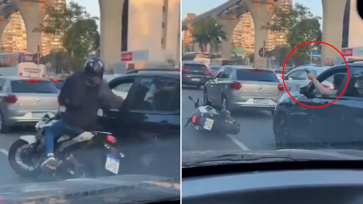 Instant karma! Moment motorcycle-borne robber trying to hijack car at gunpoint is forced to flee after driver snatches his weapon and turns the tables