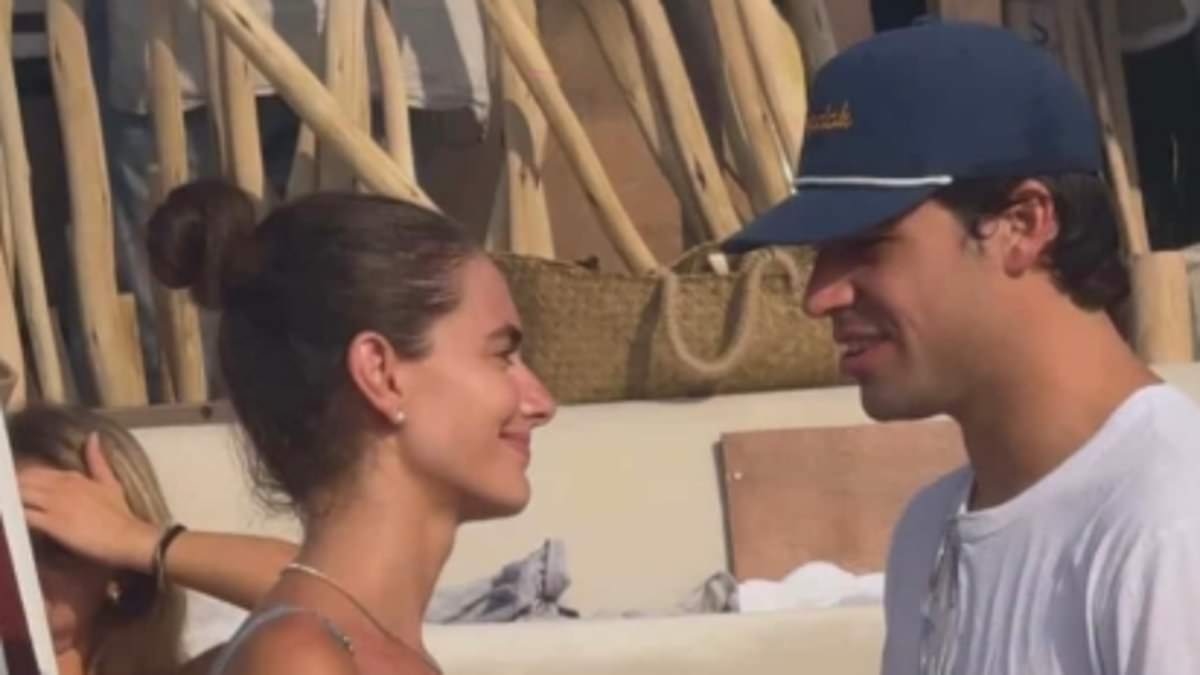 'Most beautiful woman in the world' who was trolled for her good looks could be Formula One's newest WAG after being spotted with star driver in leaked photo