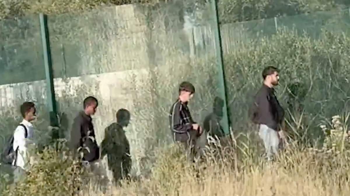 Robert Jenrick is pelted with bottles at Calais migrant camp before he's 'ignored' by French police as he reports how dozens are preparing to cross the Channel