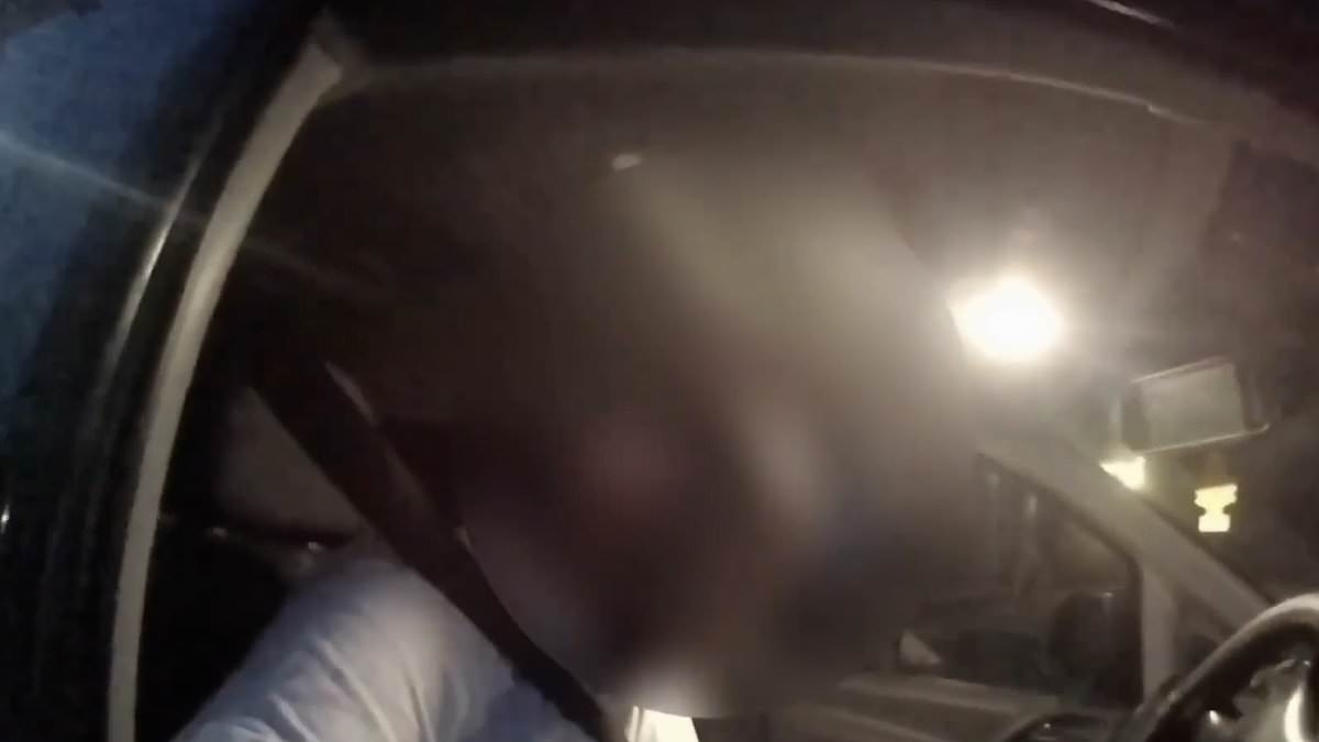 Moment suspected drink driver is caught by police ASLEEP at the wheel with the engine running