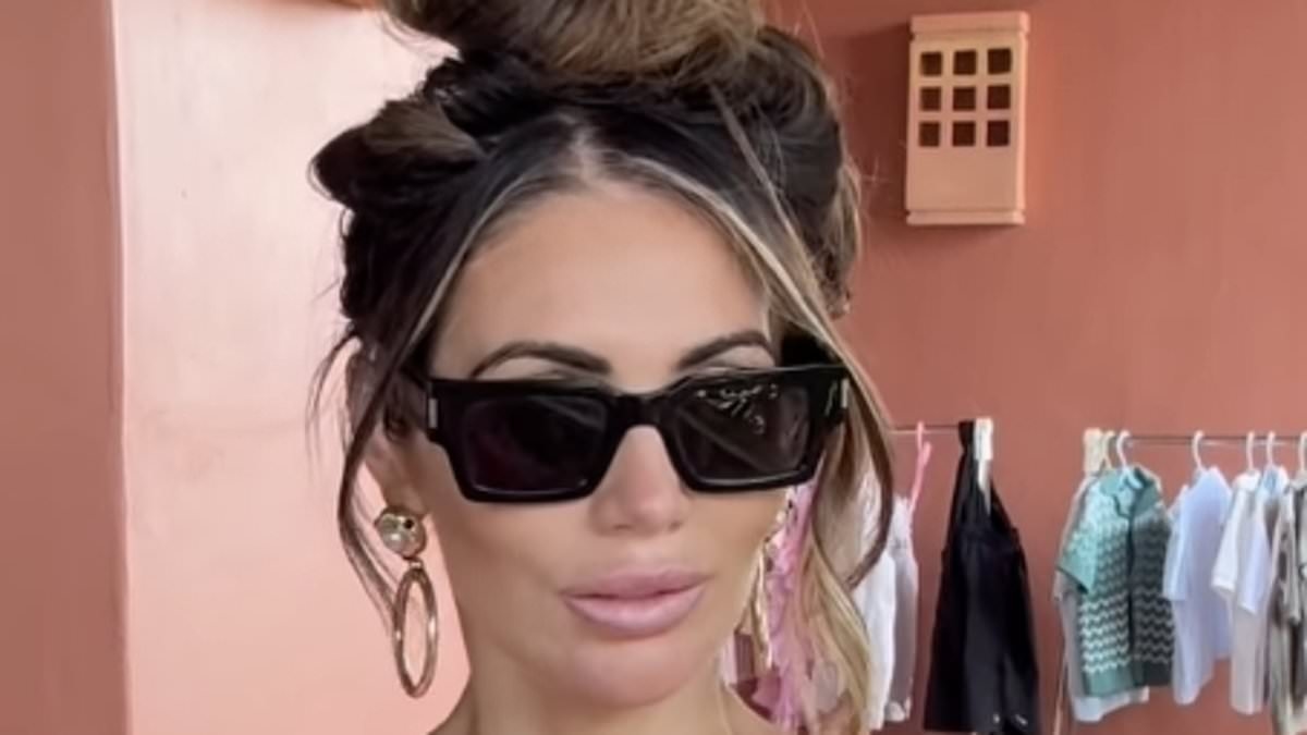TOWIE's Amy Childs shows off her trim figure in a pink swimsuit during her family summer holiday to Tenerife after sparking weight loss concerns with fans