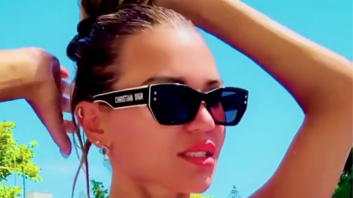 Christine McGuinness puts on a VERY busty display in tiny black bikini as she soaks up the sun - after her dramatic exit from Celebs Go Dating