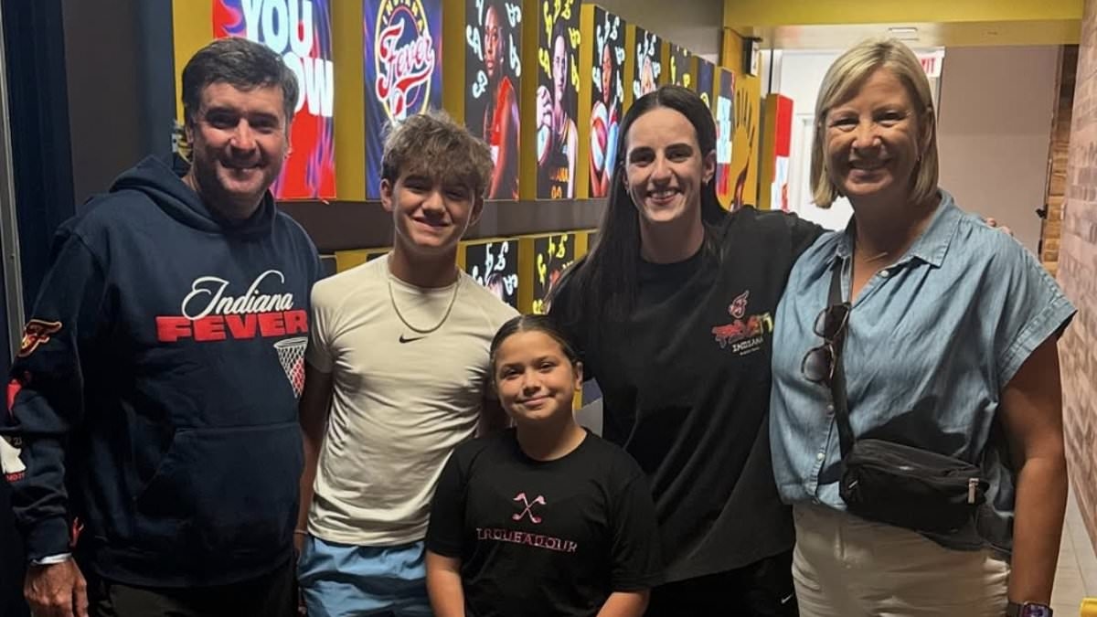 Caitlin Clark puts on a brave face for photo with golf icon... despite missing a worrying 12th straight Indiana Fever game