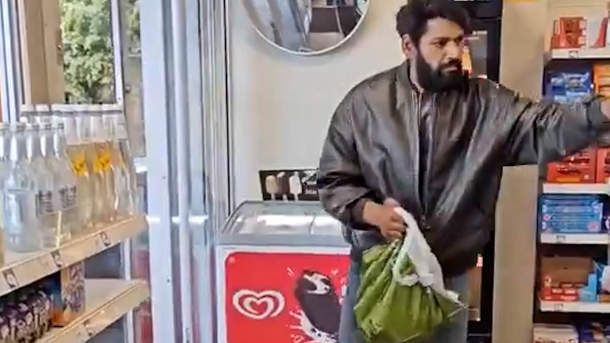 Moment sweet-toothed shoplifter pinches handfuls of chocolate in front of shocked staff and customers at a Sainsbury's