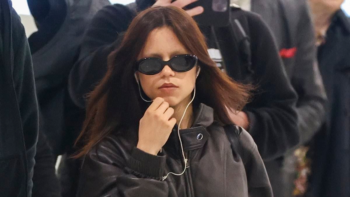 Wednesday star Jenna Ortega ditches her Gothic attire and shows off her shapely pins in tiny denim shorts as she jets out of Sydney - after dropping major spoiler for the Netflix series