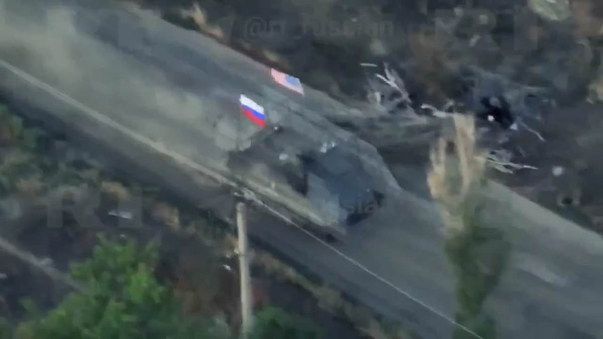 Russian troops troll Zelensky by flying US flag on captured American armoured vehicle during frontline assault ahead of Ukrainian leader's crunch talks with Trump today