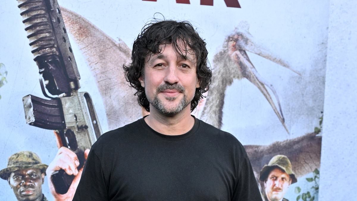 American Pie star looks almost unrecognisable as he attends Primitive War premiere 26 years after shooting to fame in raunchy teen comedy - but can you guess who it is?