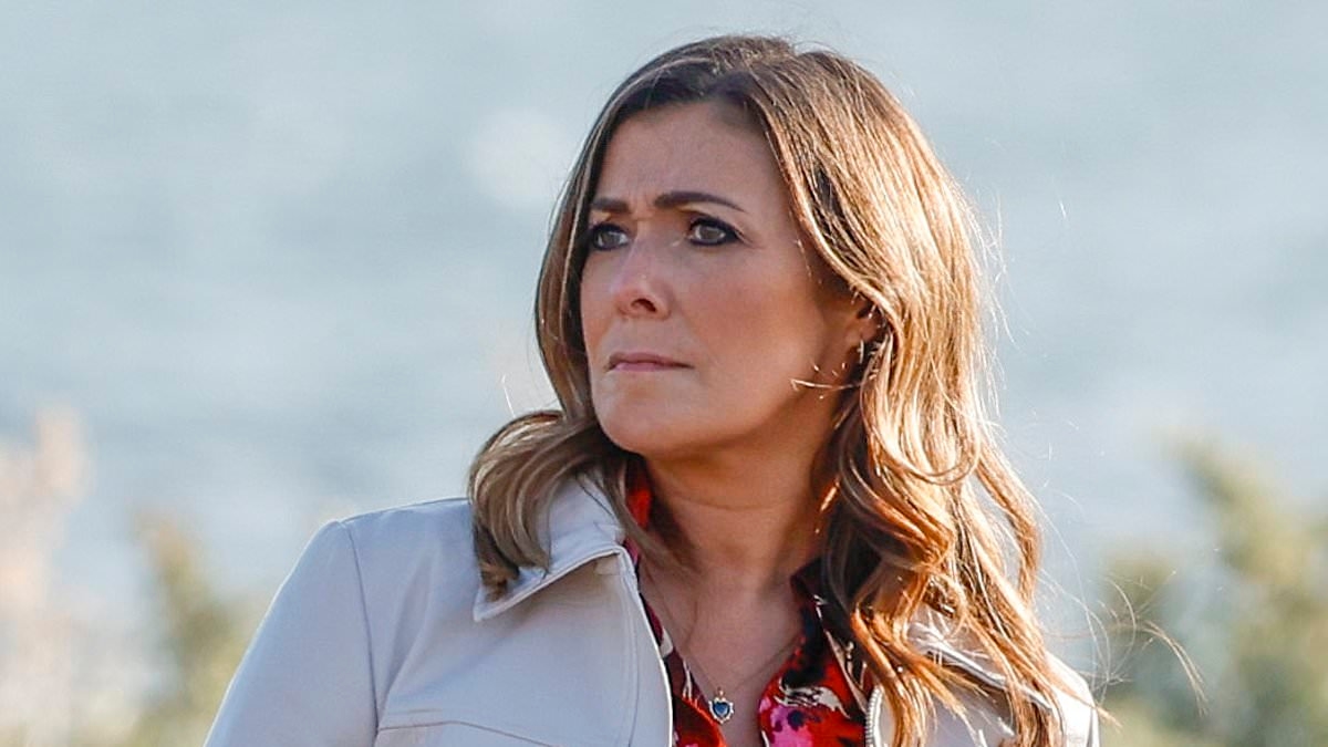 Kym Marsh puts on a leggy display in a floral minidress as she films dramatic scenes for Channel 5 series Imposter in a beachside carpark in Melbourne