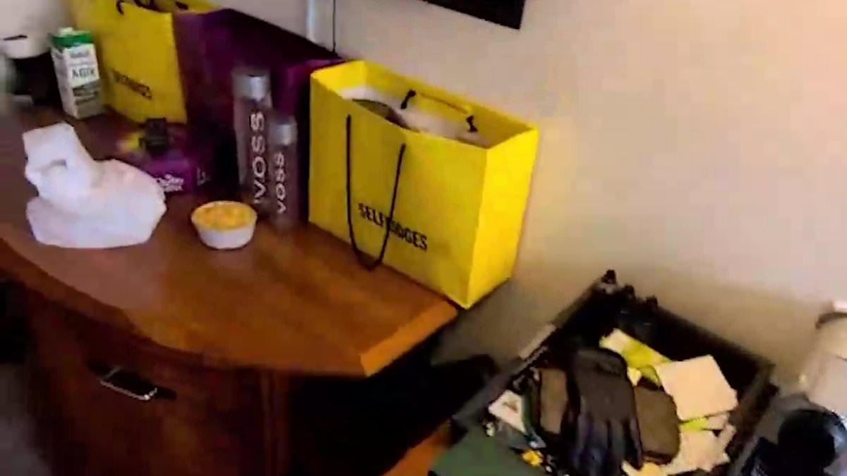 The luxury life of migrant in taxpayer-funded hotel: Sudanese asylum seeker is pictured with Macbooks, Louis Vuitton wallet and even luxury water paid for by running 'Silicon Valley style' business from his bedroom