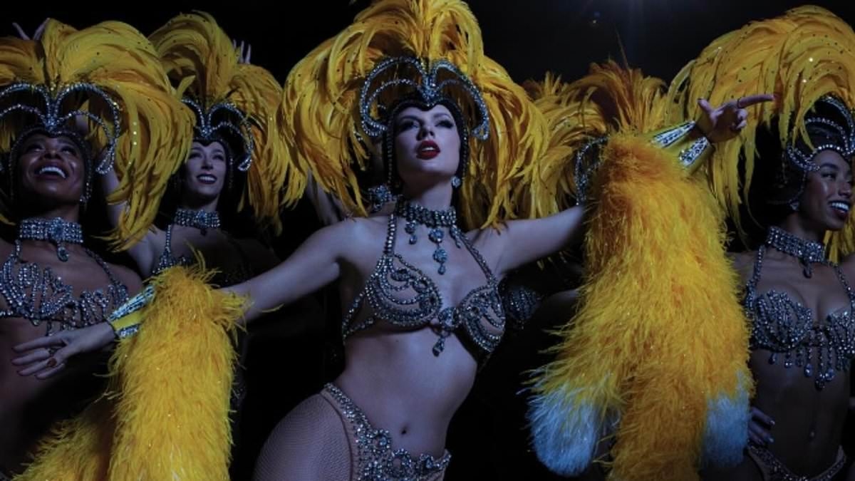 Taylor Swift stuns in a racy rhinestone bikini for vinyl release of Baby, That's Show Business
