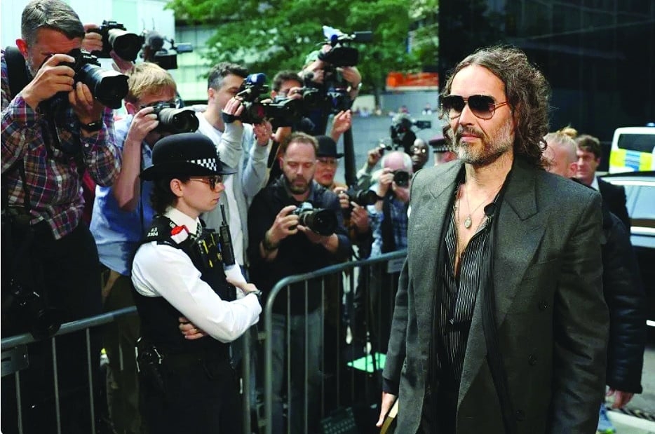 Russell Brand pleads not guilty
