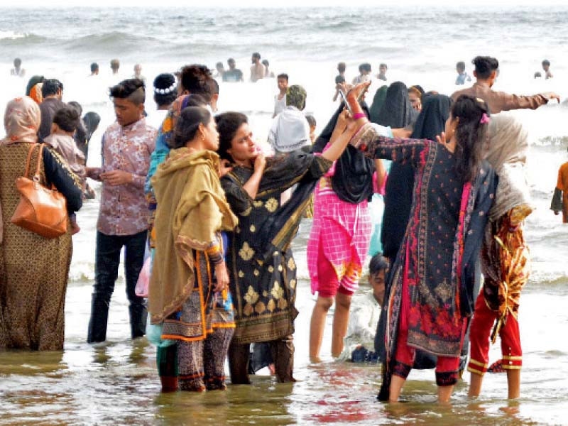Revelers hit the beach, food streets