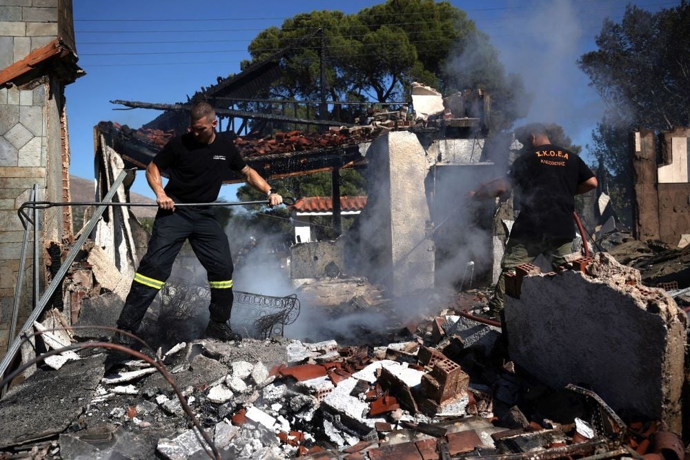 Greek firefighters battle fresh blaze near Athens as Crete fire retreats