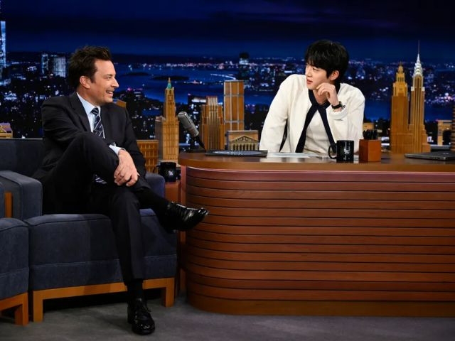 BTS Jin transforms Tonight Show stage into giant bed for cozy performance and playful interview with Jimmy Fallon