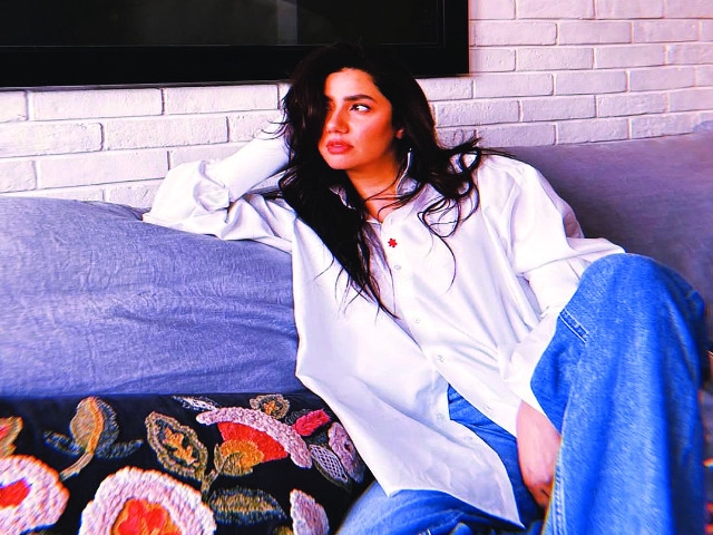 Mahira Khan blooms in white button-up and denim