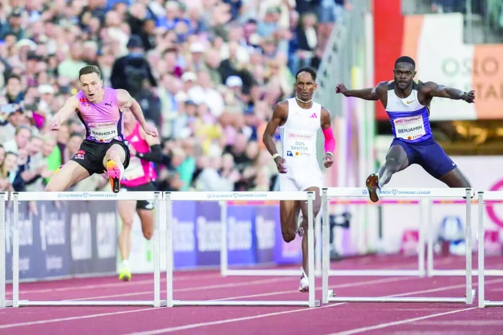 Warholm breaks hurdles world record