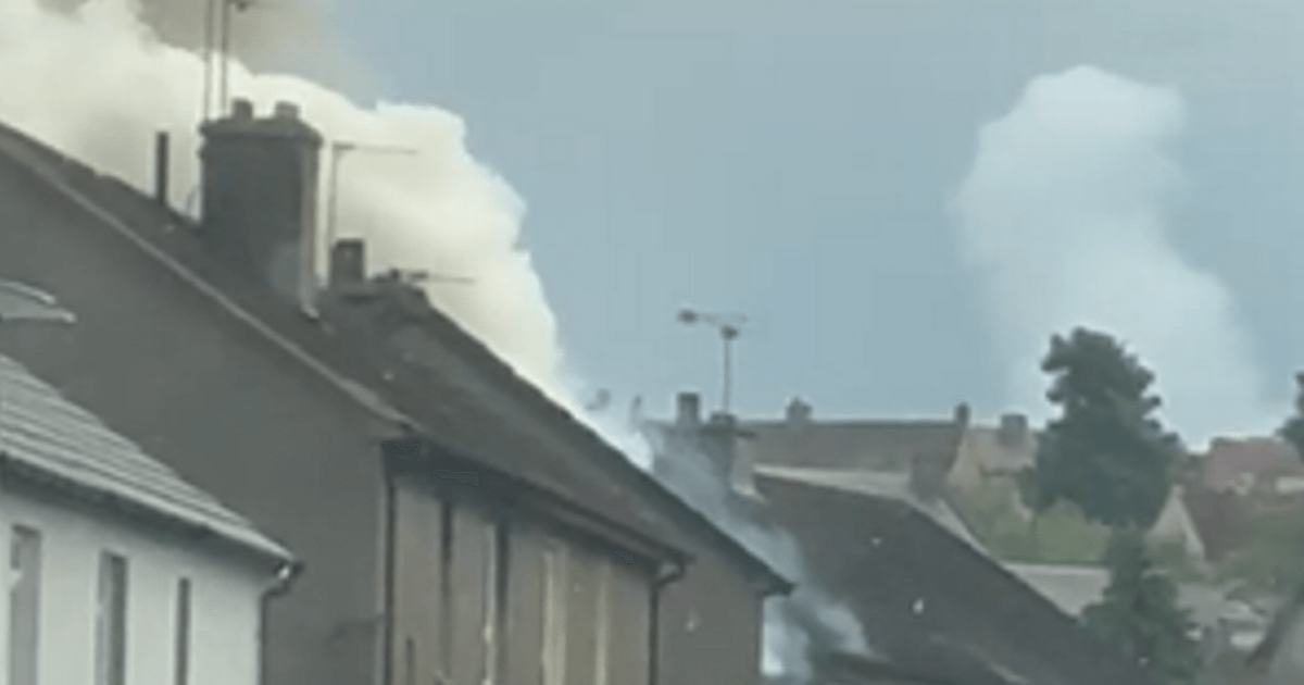 Firefighters tackling blaze affecting two houses in Scots town as locals watch on in horror