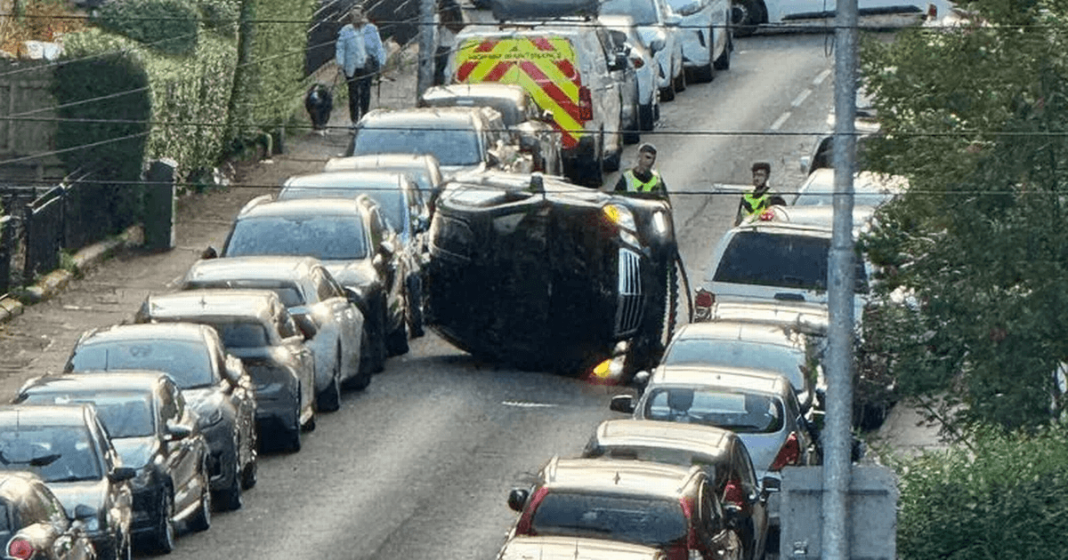 Car flips onto side on Glasgow street after multi-vehicle smash as man charged