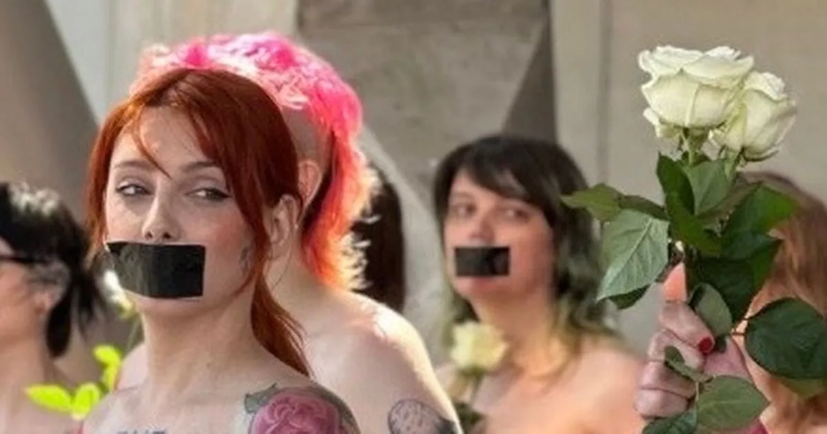Trans women gather in topless Scottish Parliament protest against supreme court ruling