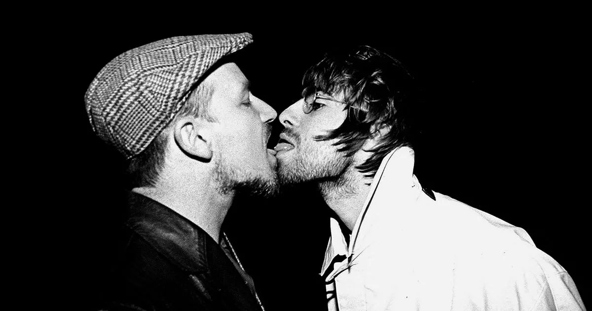 Snapper behind the Liam Gallagher/Bono kiss pic says it turbo-boosted his career