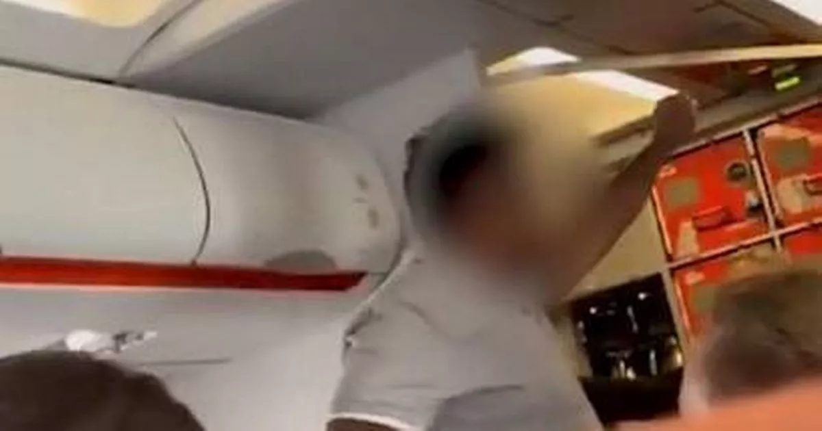 Stunning moment plane passenger is tackled on flight after 'Allahu Akbar' shouts