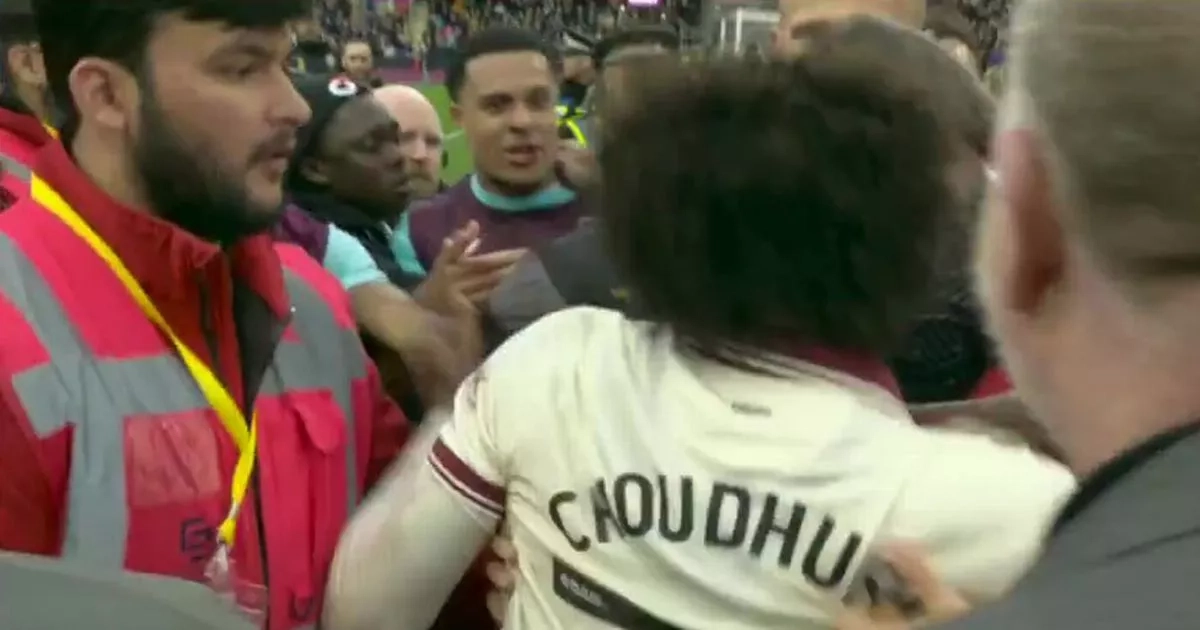 Sheffield United star held back after furious clash with opponents amid pitch invasion chaos