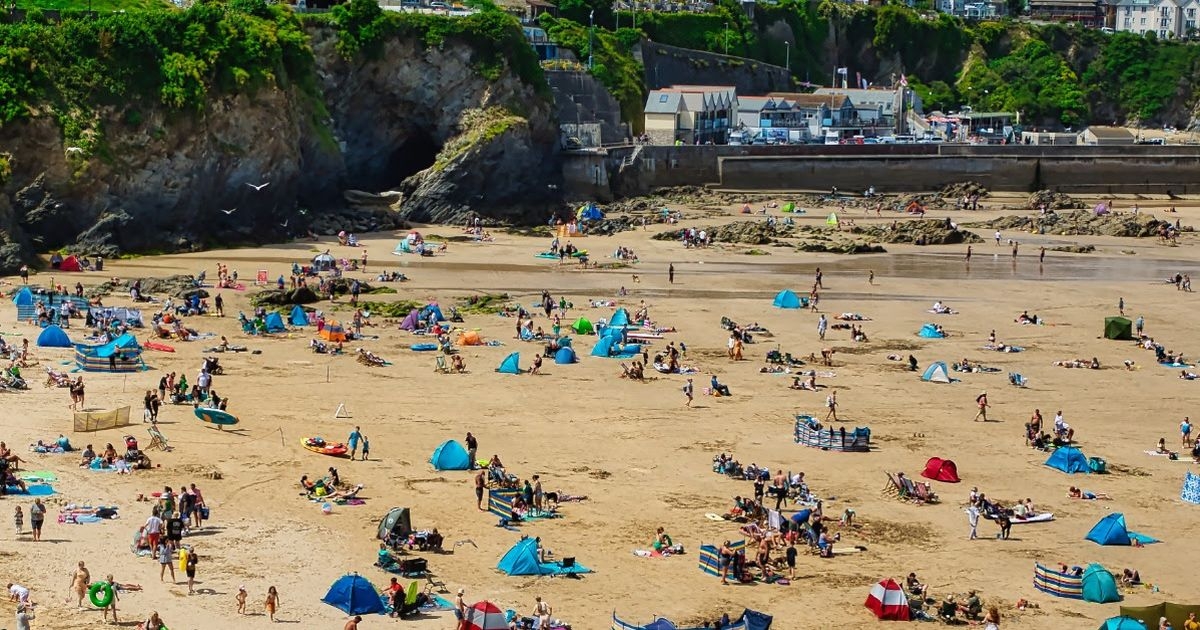 Only those with razor sharp vision can spot tiny ball on busy beach in 3 seconds