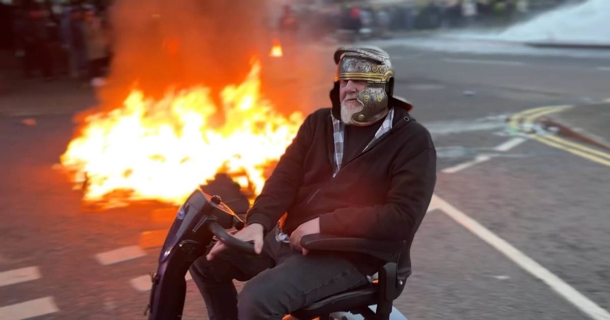 Bloke in Roman helmet on mobility scooter taunts cops during Ballymena riots