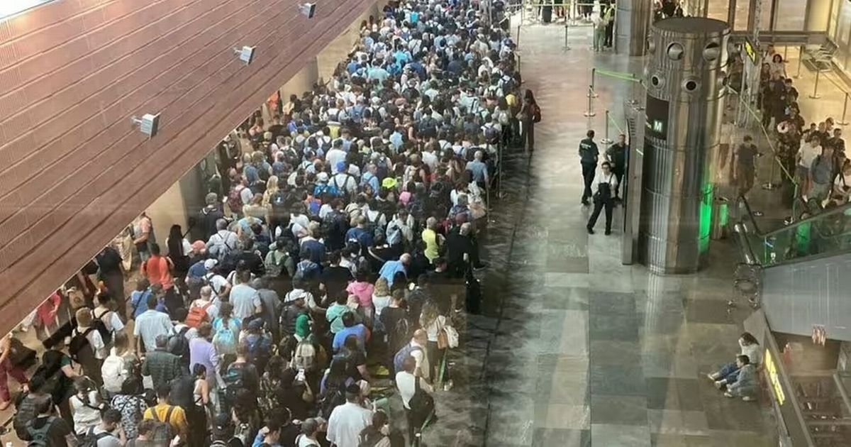 Fights break out at major holiday spot airport as passport control 'collapses'