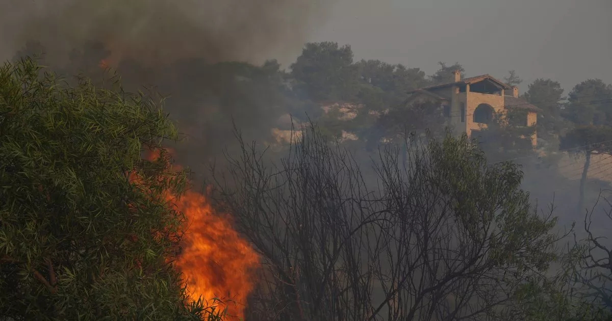 Two found dead in burned car as horror fires ravage Brit holiday hotspot