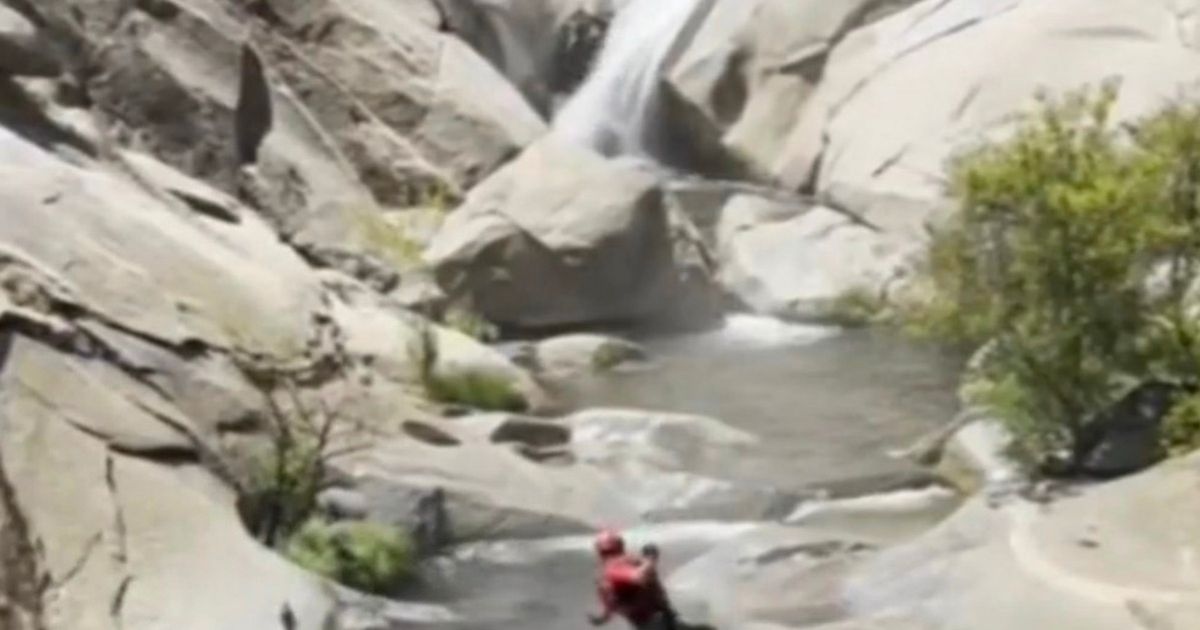 Missing man found ALIVE after spending two days on cliff trapped behind waterfall