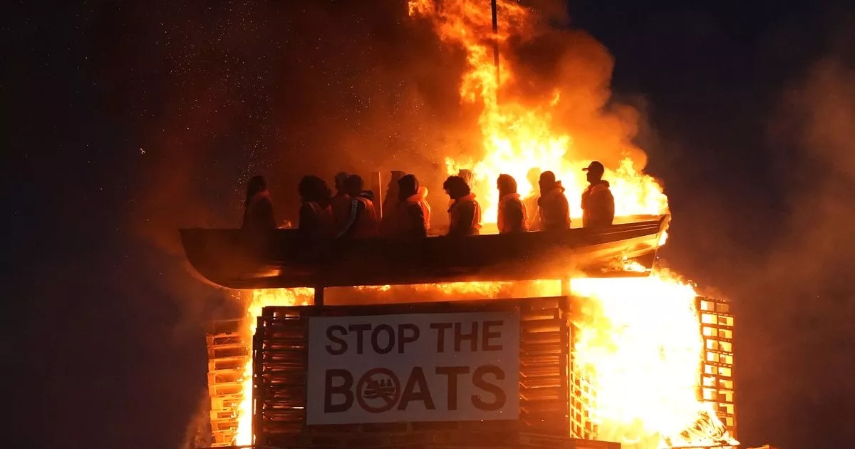 Fury over as 'migrant boat' bonfire branded 'disgusting' is set alight